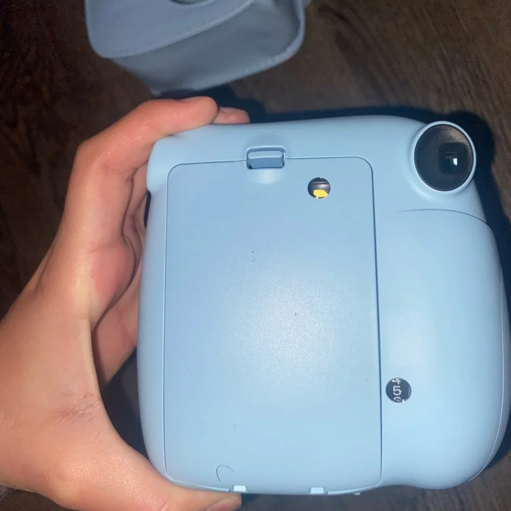 Baby Blue Polaroid Camera with photo book, film, and etc.